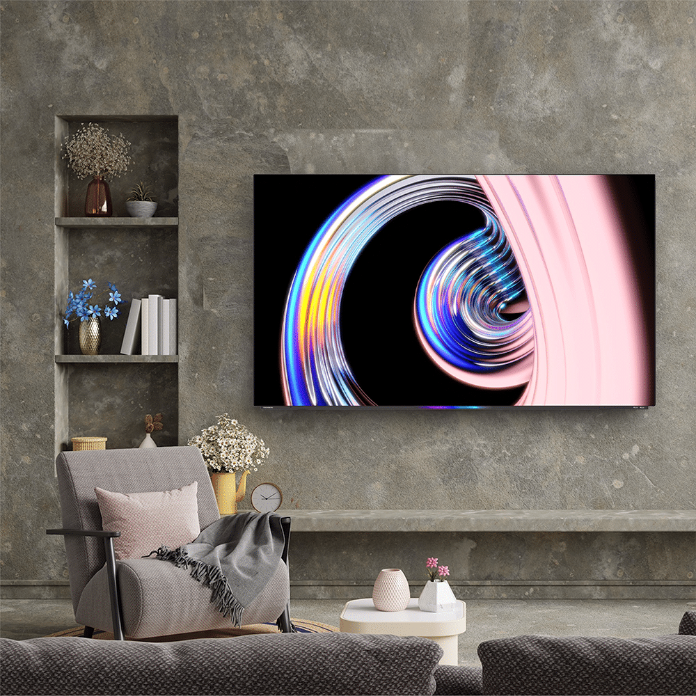 Thomson 65” OLED Google TV asennettuna olohuoneeseen – kehyksetön design ja elegantti sijoittelu.